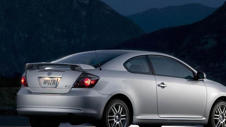 2009 Scion TC In Silver Near Mountains Pose In Night